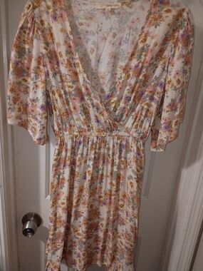 Rewind Floral Wrap-Style Cream Dress with Pastel Bouquet